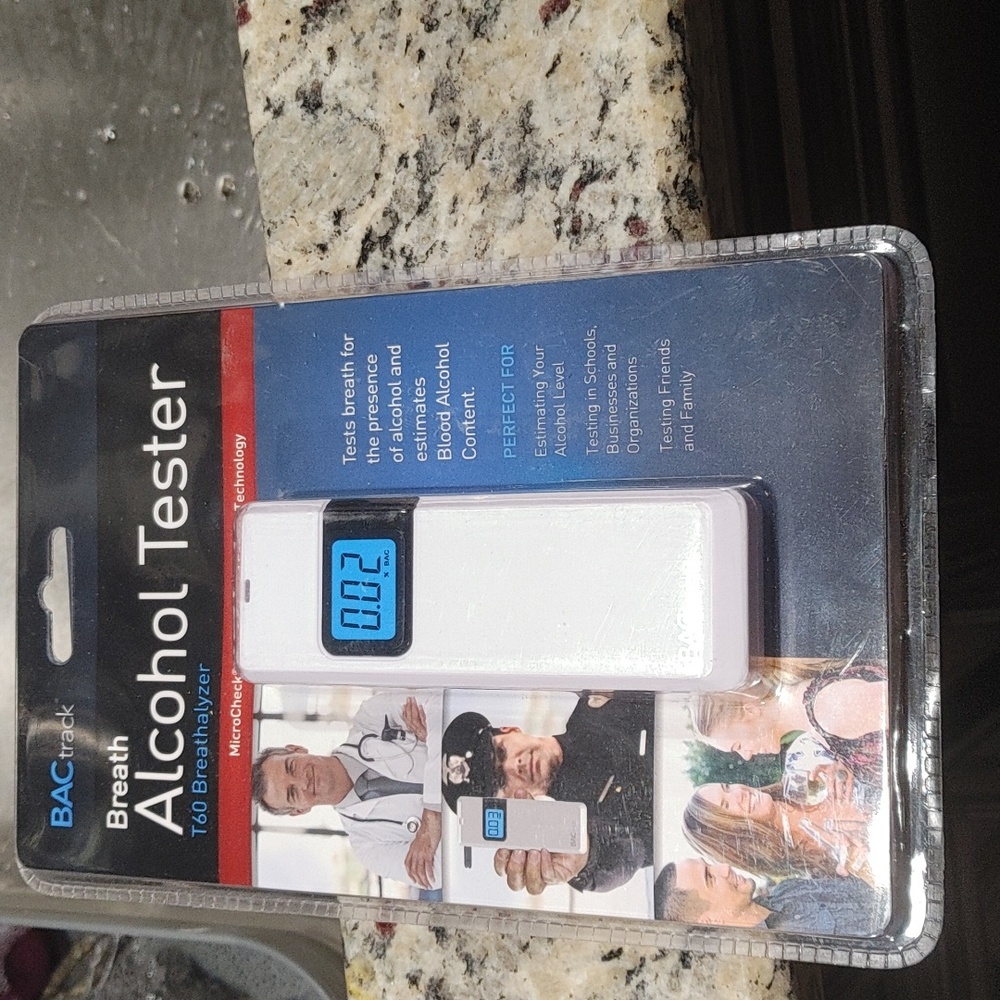 Breath alcohol tester by:BACtrack. White and absolutely Brand New in packaging.